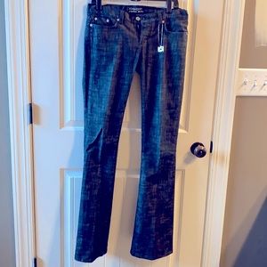 Denim Bebe jeans with an ashy undertone.